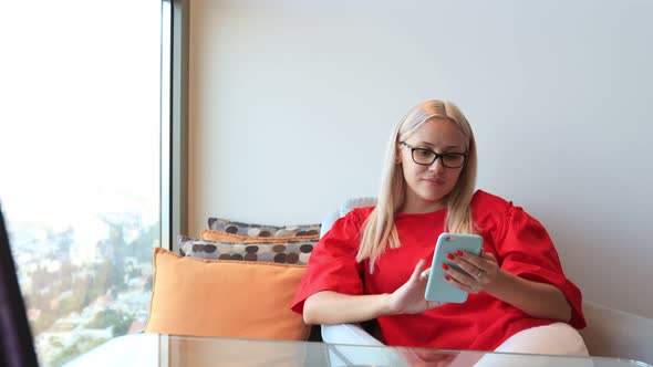 Woman Shopping Online By Use Smart Phone at Her House