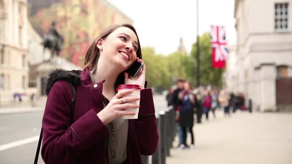 Young woman in London talking on the phone alt
