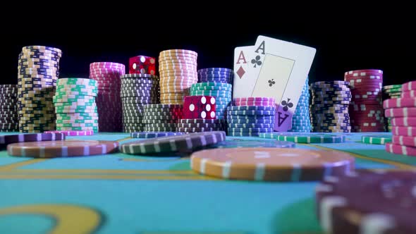 Set of Colorful Chips Playing Cards and Red Dice on a Gaming Table for Gambling in a Casino alt