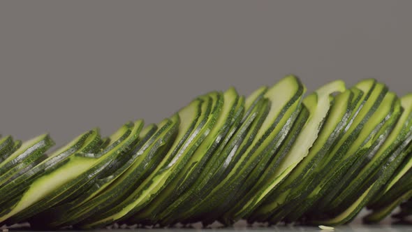 Thinn Slices of Zucchini Pushed From the Sides