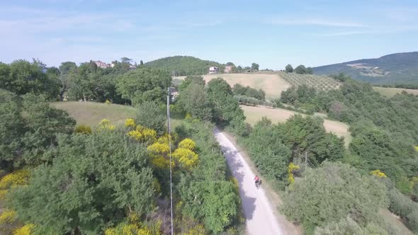 Man cycling with mountain bike on countryside road