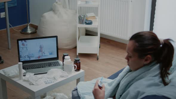 Sick Patient Talking to Doctor on Video Call for Telehealth alt
