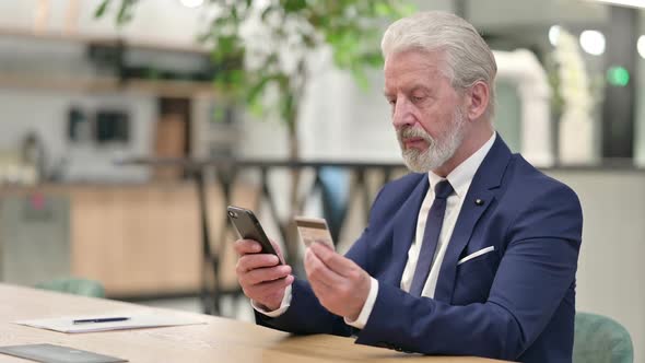 Businessman Successful at Online Payment on Smartphone alt