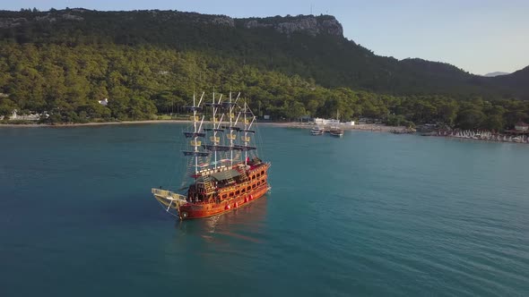 harbor at Dakapo beach with the pleasure boats, yachts and green mountains alt
