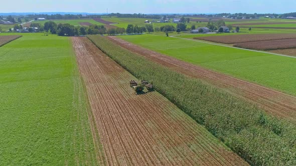 Aerial View of Rural America of Amish Farmlands With Amish Harvesting the Crops alt