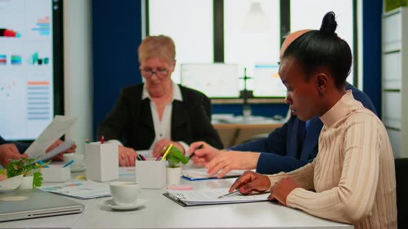 African Businesswoman Reading Documents Signing Its alt