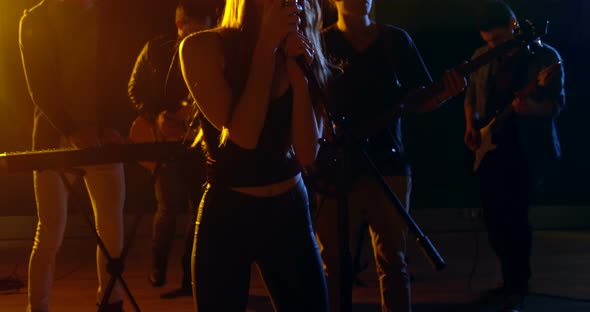 Band performing in studio alt