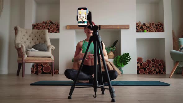 Woman Blogger Fitness Lesson Online Taking Pictures Mobile Phone alt