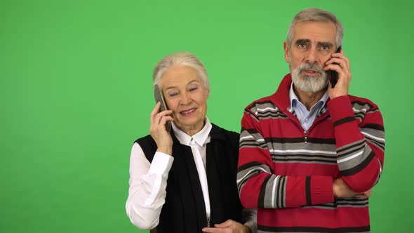 An Elderly Couple Talks on Two Smartphones - Green Screen Studio alt