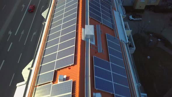 Solar power panels on top of residential building roof for producing of green ecological electricity alt