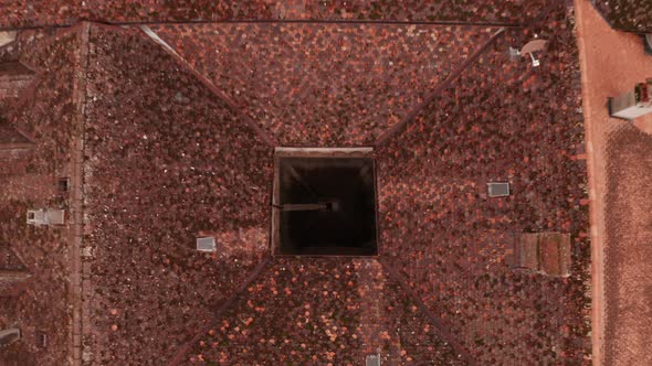 Top down aerial lift of small courtyard on monumental building in rural Switzerland alt