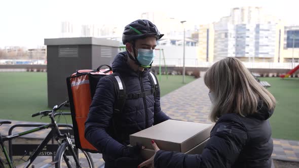 Food Courier Delivering Pizza to Customer By Bike alt
