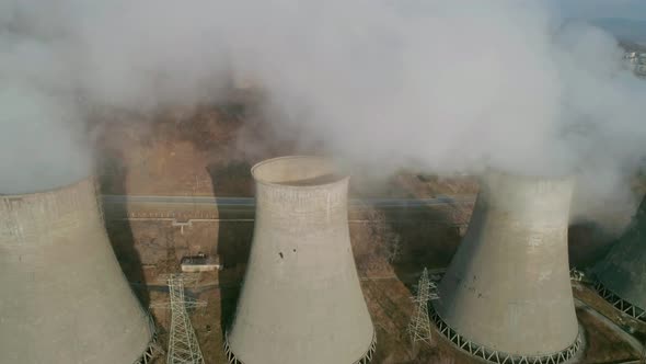 Aerial View of an Industrial Zone Pipes Pouring Thick White Smoke alt