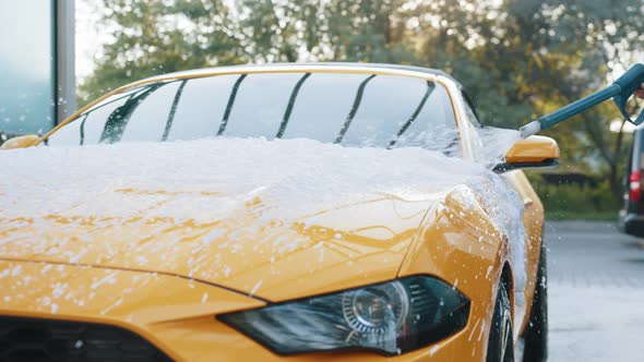 Young Coucasian Woman in Business Outfit Shirt and Trousers Washing Her Yellow alt