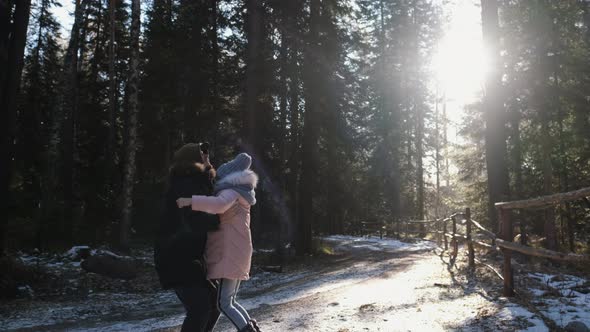 Cute Teenage Girl and Her Father Are Having Fun in Nature Near the Forest alt