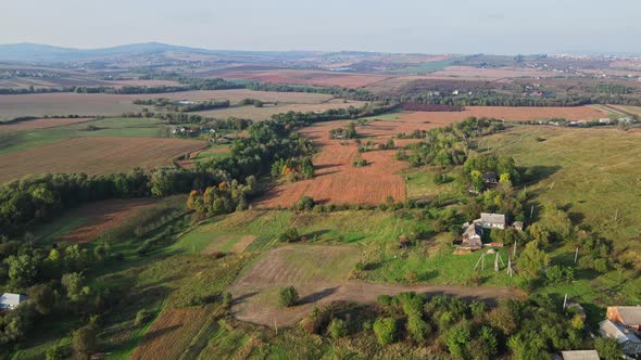 Flight over the fields behind the western Ukrainian village Aerial view.