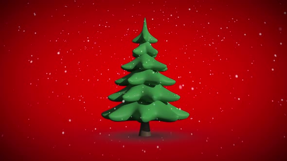 Snow falling on revolving fir tree alt