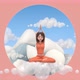 A girl on a cloud in a yoga pose against the background of mountains - VideoHive Item for Sale