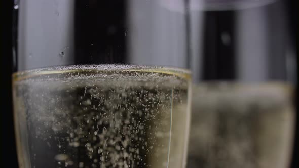 Close Up of a Two Glass of Champagne. Black Background alt