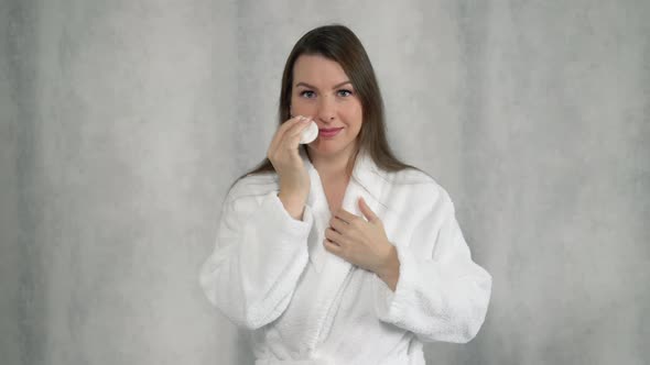 Girl Cleans Skin with a Cotton Pad Applies Tonic Cream Foundation Cosmetics