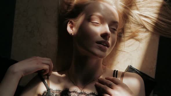 art fashion surrealistic portrait of beautiful woman with a beamof light and shadow on her face alt