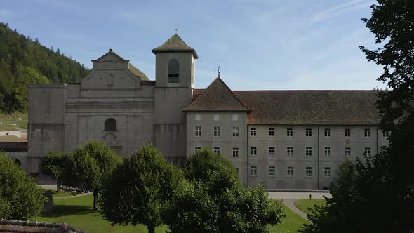 Abbey surrounded by trees on a beautiful sunny summer day. Drone DJI Mavic alt