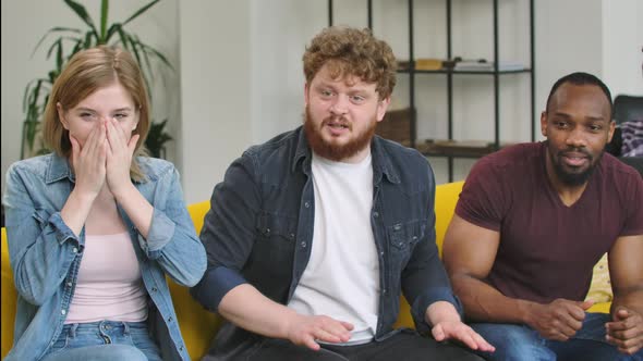 A Multinational Group of Men and Women Looking Into the Camera with Excitement and Worrying Then alt