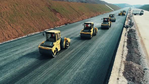 Road Rollers Compacts the Asphalt alt