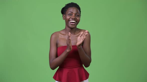 Young Beautiful African Woman Clapping Hands