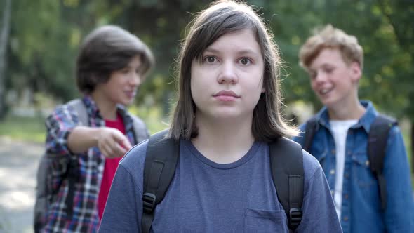 Portrait of Scared Overweight Caucasian Schoolboy Looking at Camera with Fear in Eyes As Blurred alt