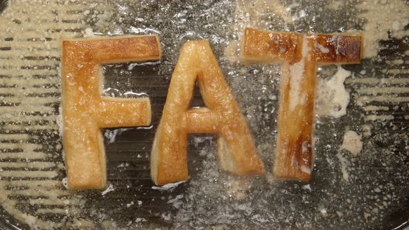 FAT letters fry in oil in a grill - boils