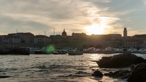Timelapse in the Old Port of Dubrovnik at sunset alt