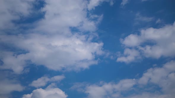 Clouds Move Smoothly in the Blue Sky. Timelapse alt