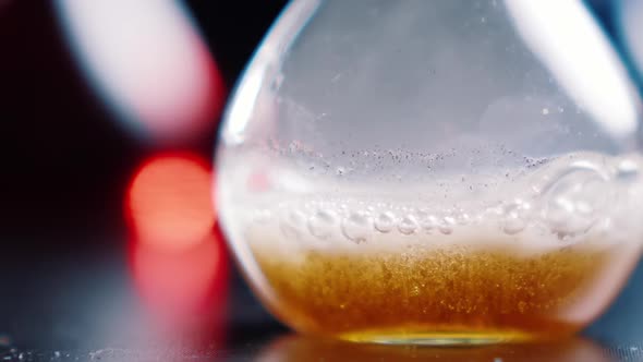 Strong chemical reaction in medical laboratory, close-up. Boiling, foaming. Chemistry test alt