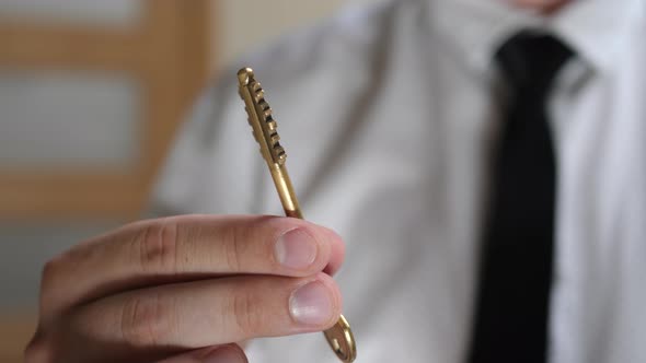 Hand of Businessman Gives Home Key