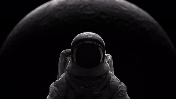 Astronaut stand in galaxy with moon background.