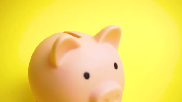 Pink Money Box Bank at Yellow Background