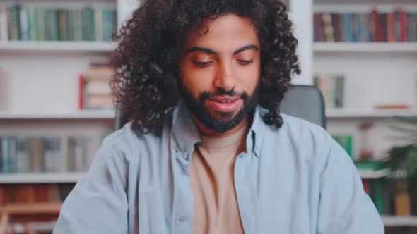 Young Happy Arabian Man Freelancer Opens Laptop and Typing Sits in Home Office alt