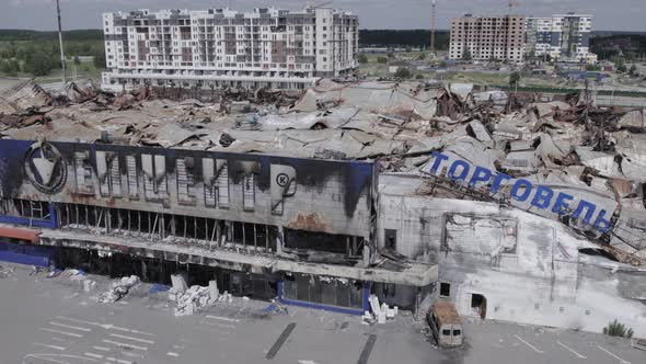 War in Ukraine  Destroyed Building of a Shopping Center in Bucha alt