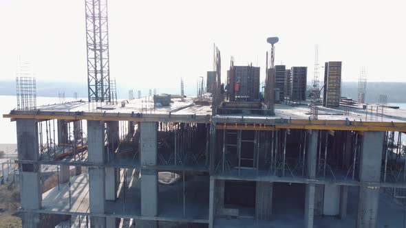 construction of the new building. Building under construction with crane alt