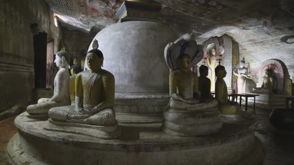 DAMBULLA, SRI LANKA - FEBRUARY 2014: Many sitting and standing Buddhas at the Golden Temple of Dambu alt