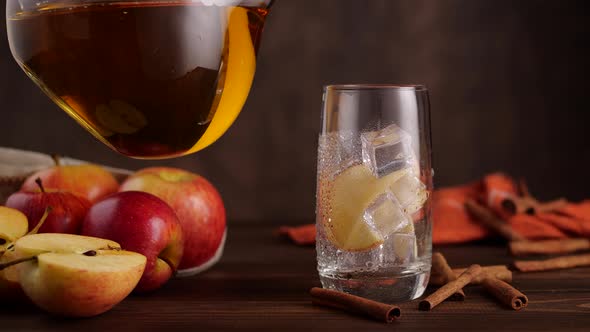 Anonymous Person Pouring Apple Juice in Glass