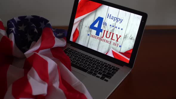 Laptop with Inscription Happy Independence Day on Usa Flag