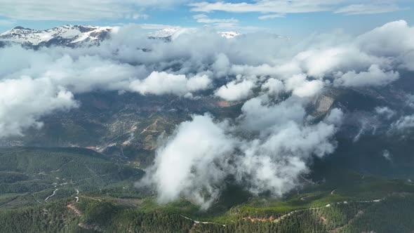 Cloudy landscape high in the mountains aerial view 4 K alt