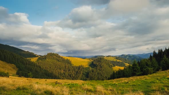 Clouds Flowing on the Blue Sky in Mountains Landscape on Background alt