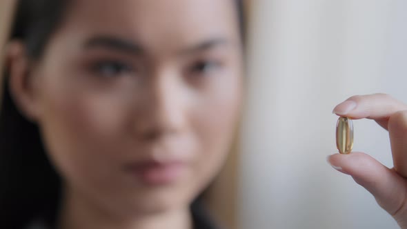 Extreme Closeup Female Blurred Female Face Asian Girl Korean Sick Ill Woman Holding Vitamin Pill alt