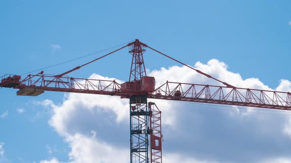 Timelapse of Working Construction Building Crane on Blue Sky Background