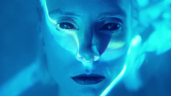 Futuristic Woman in Studio with Laser Light alt