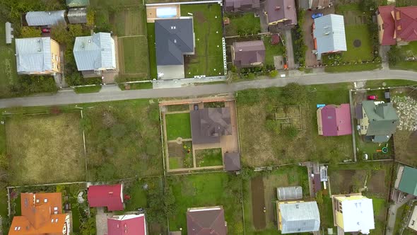 Aerial view of home roofs in residential rural neighborhood area. alt