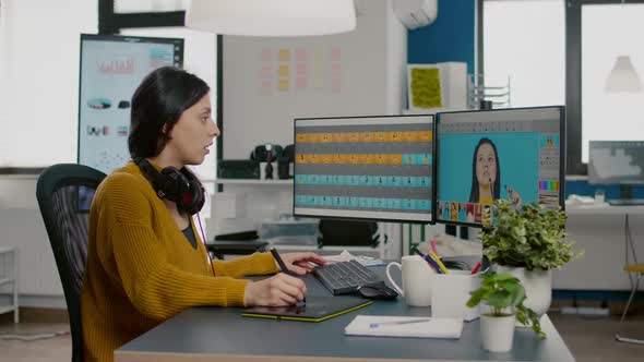 Satisfied Photo Editor Retouching Image Using Graphic Tablet alt